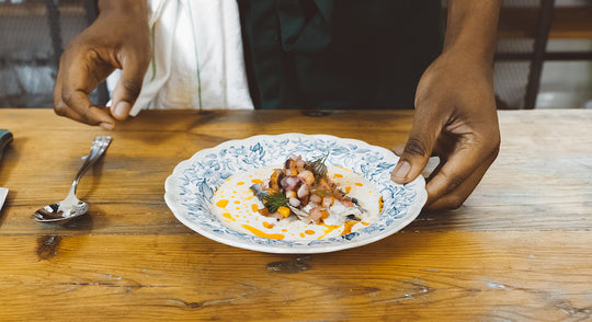 Sardine and vegetable condiment plate with robot milk